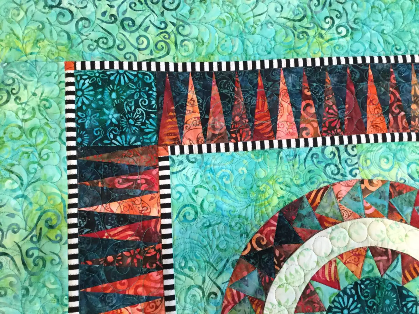 A close up of the fabric on a quilt