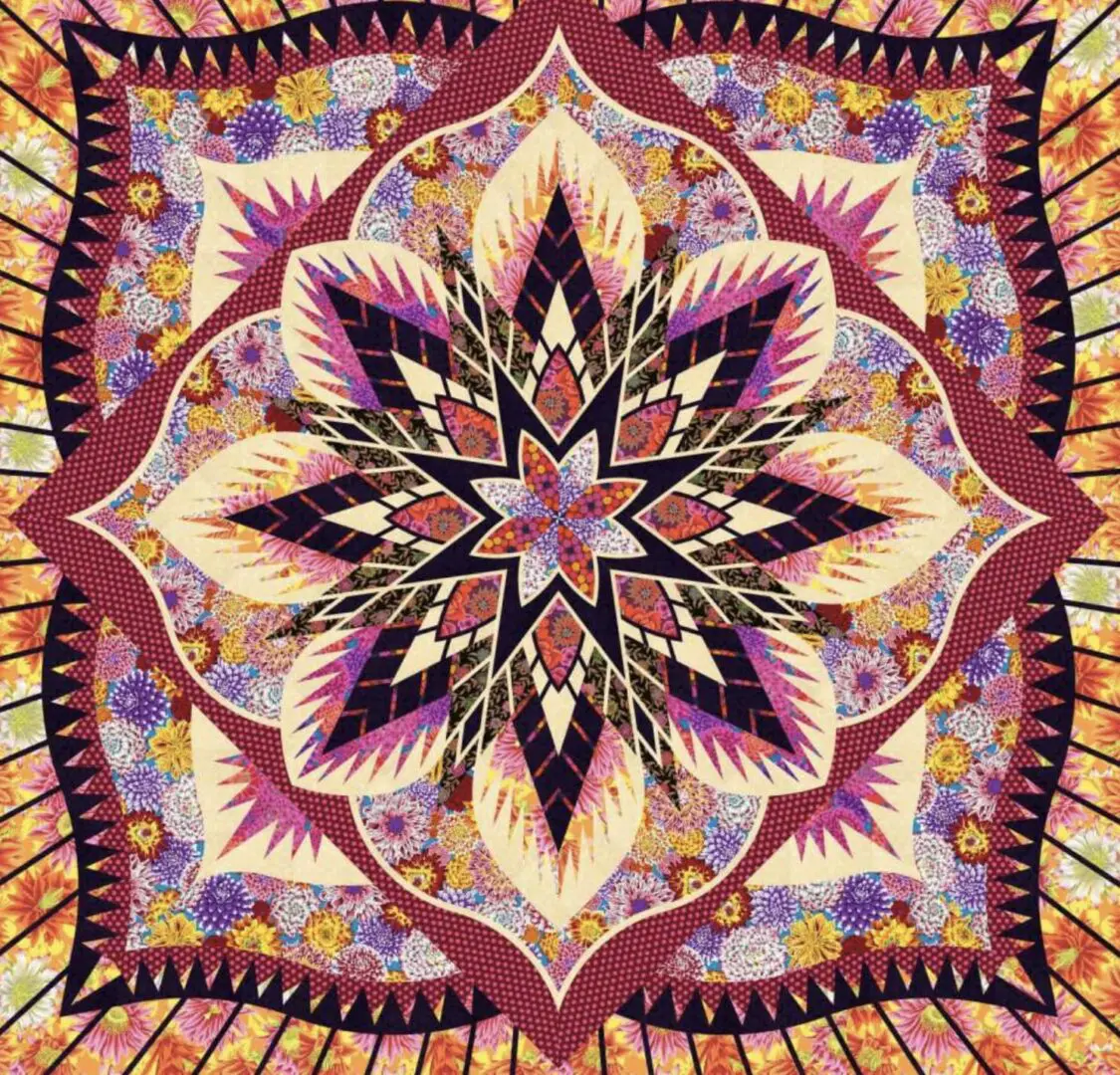 A colorful quilt with a star design on it.