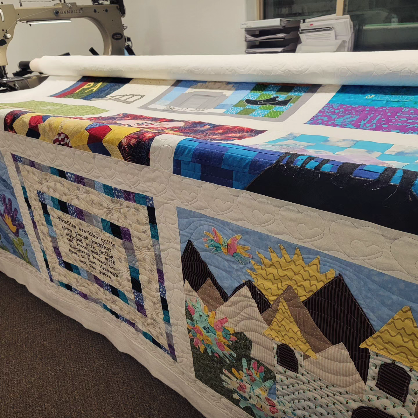 A large quilt on display in the sewing room.