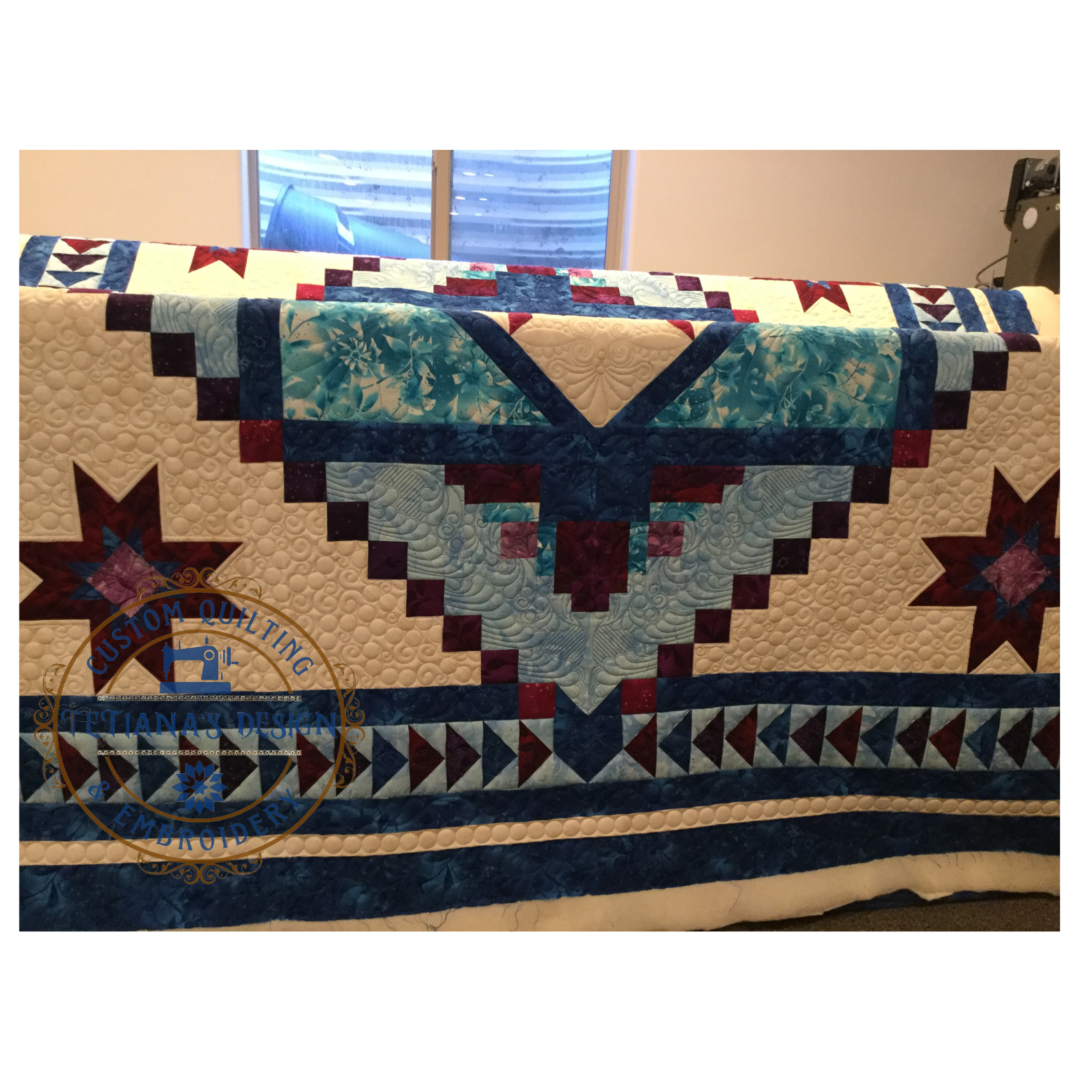 A blanket with a design of stars and a cross.