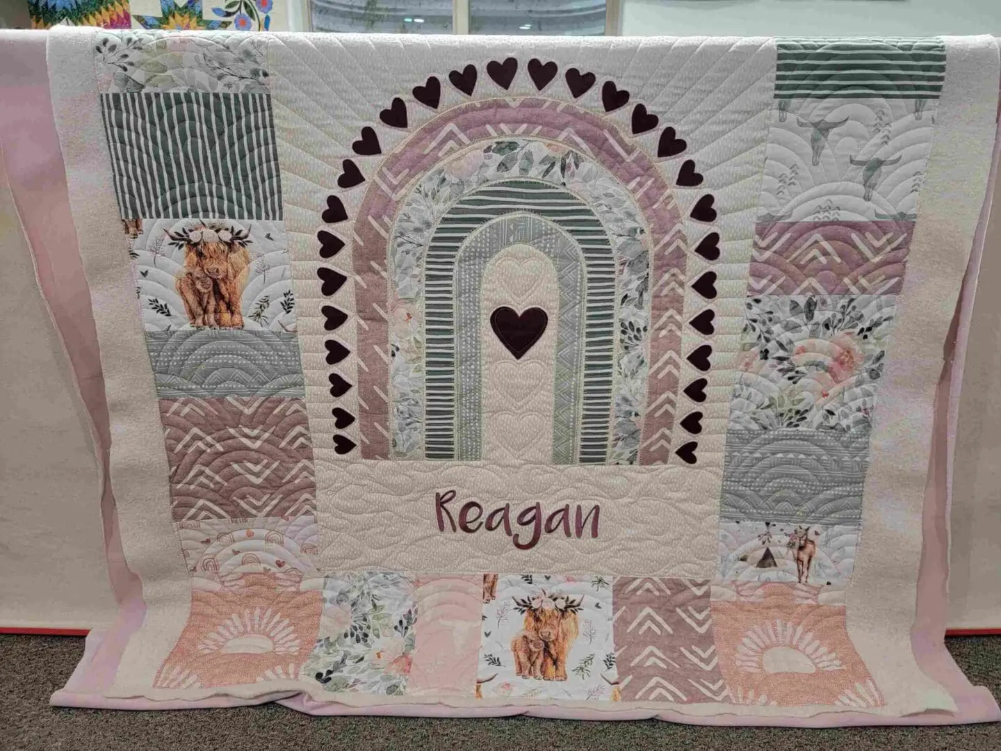 A quilt with the name keigei on it.