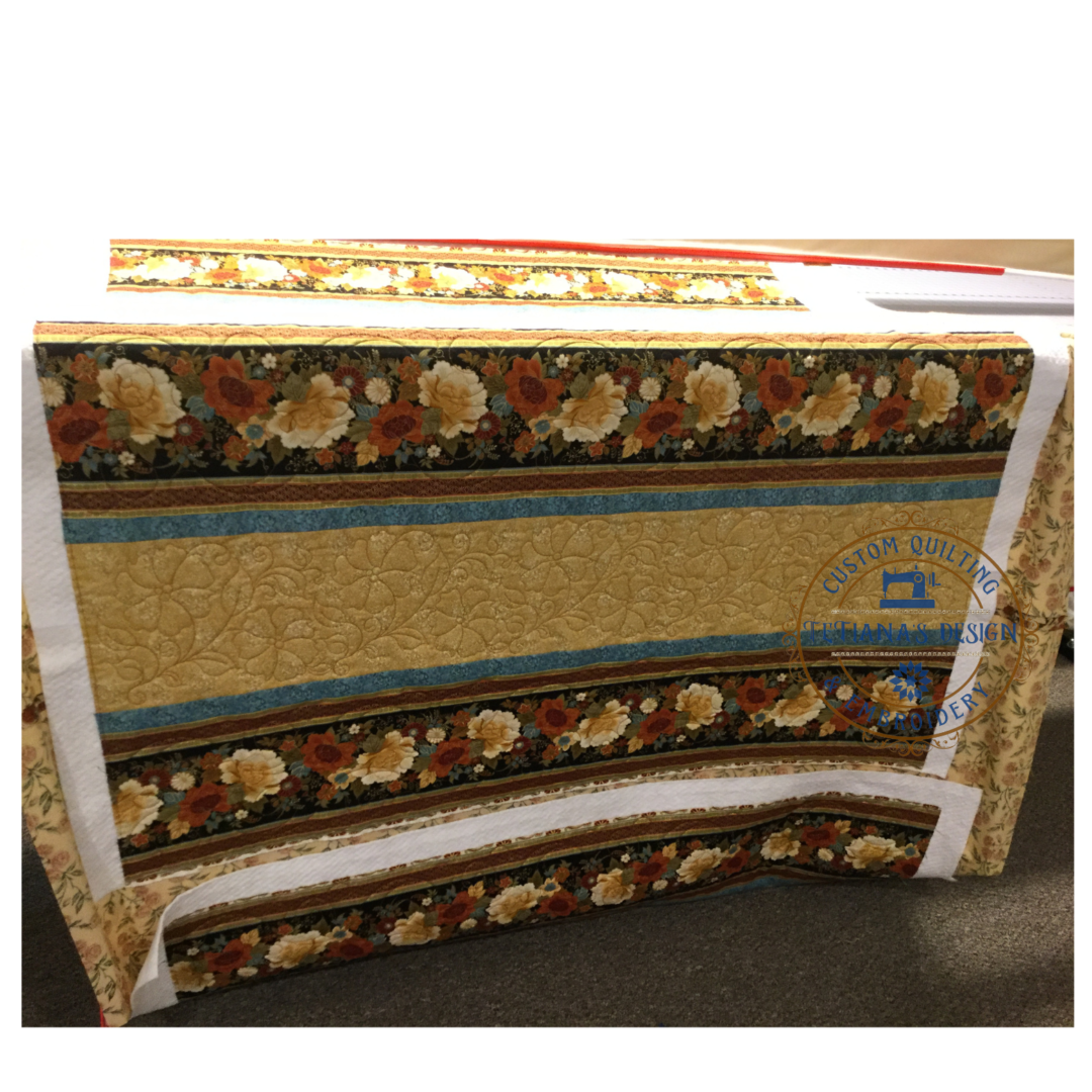 A bed with floral fabric on it.