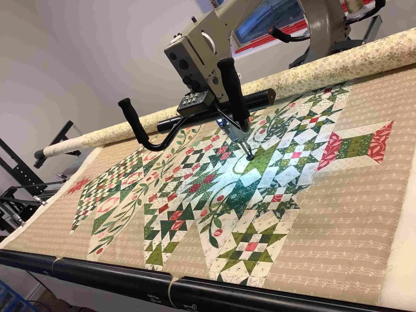 A machine cutting fabric with a large blade.