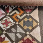 A close up of the quilt on the floor