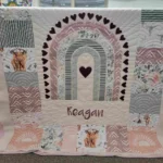 A quilt with the name of regan on it.